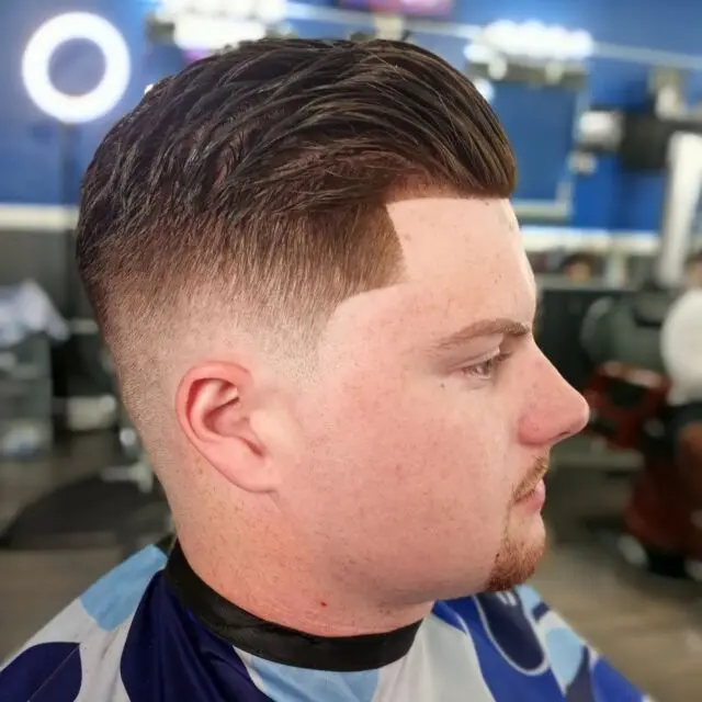 A fresh skin fade with a textured top on an adult client