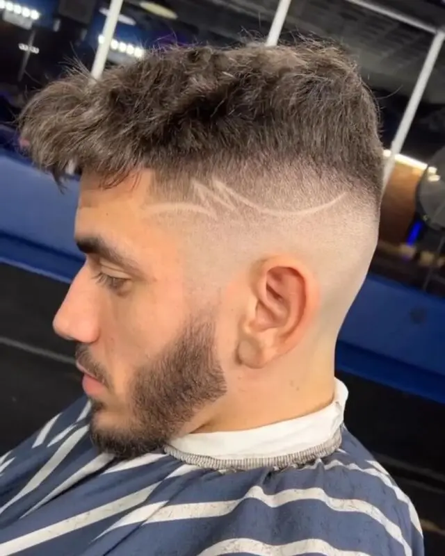 Textured crop with a skin fade and beard line-up