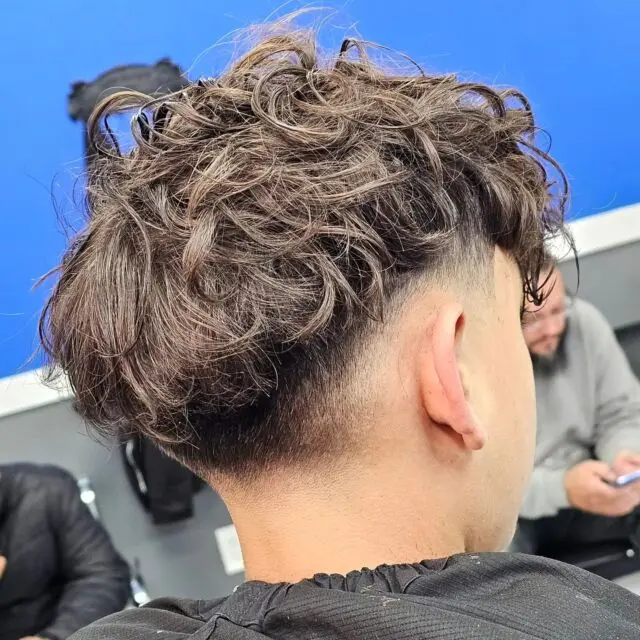 Curly mullet with a burst fade
